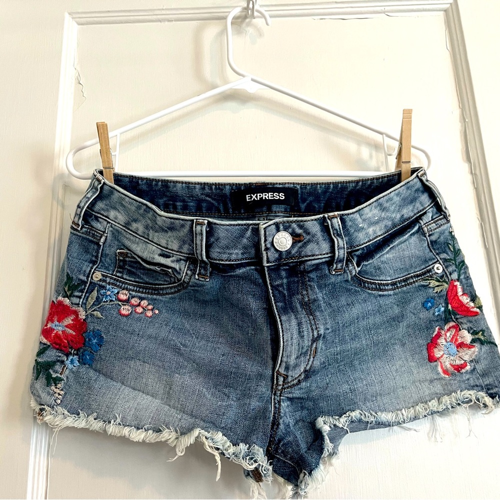 Jean cut off shorts with floral embroidery on sides. Size 6